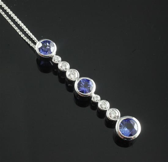 A modern white gold, sapphire and diamond drop bar pendant, pendant 44mm.